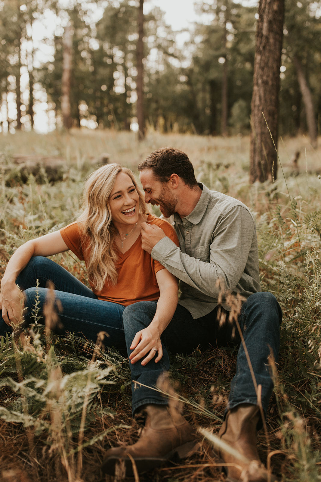 couple laughing in sedona forest
