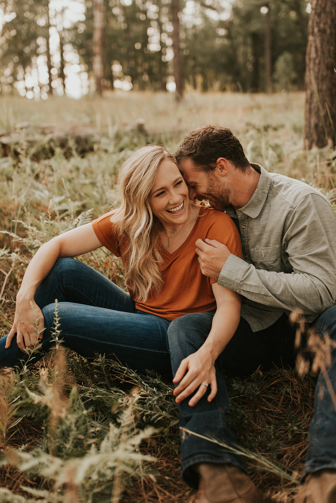 couple laughing in sedona forest