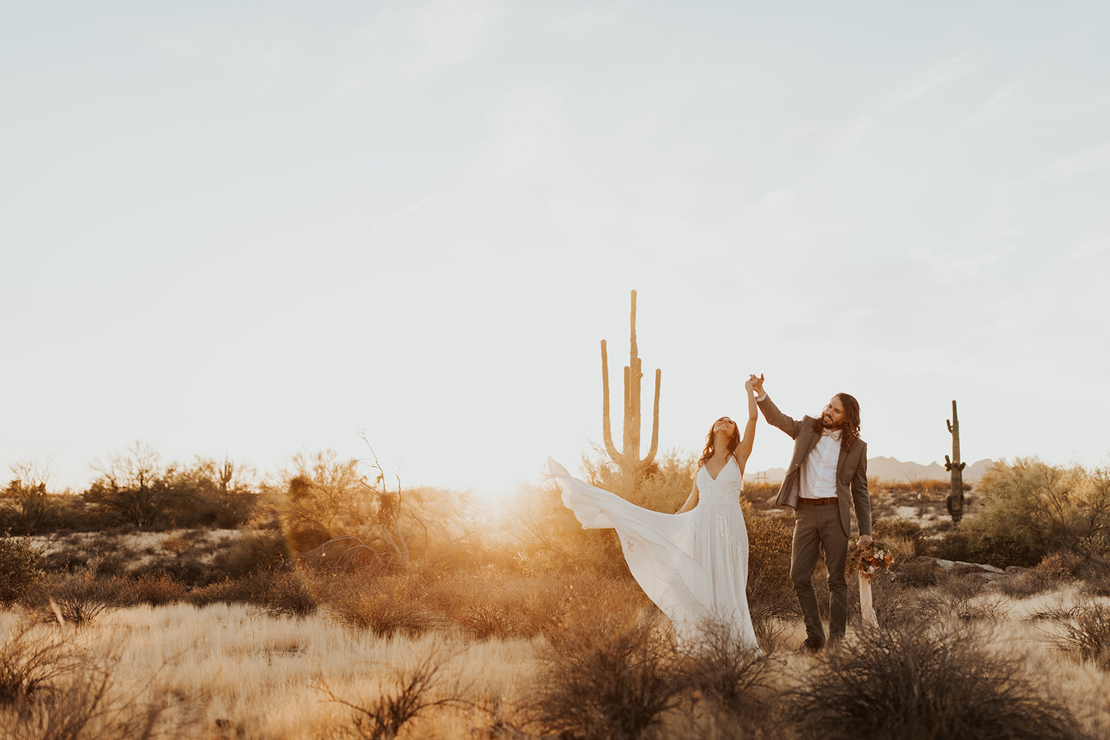 Engaged Couple takes Photos at Sunset