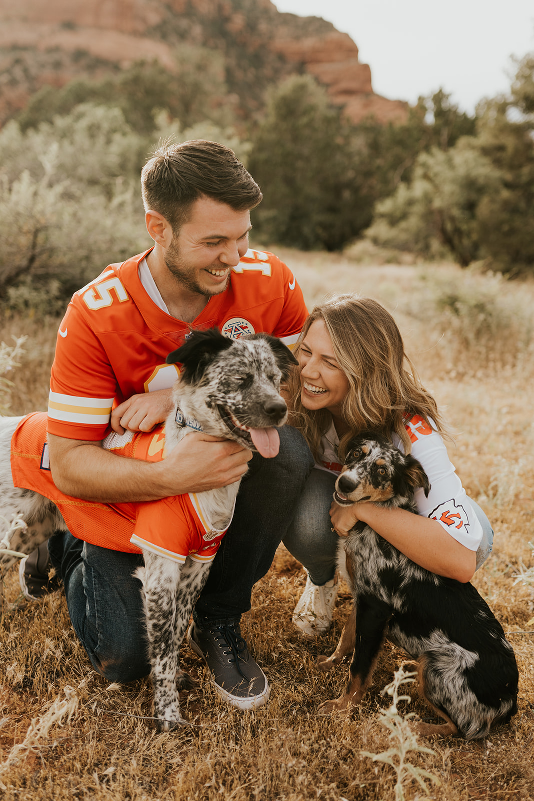 Engaged couple take photos with their pets at Superstition Mountain