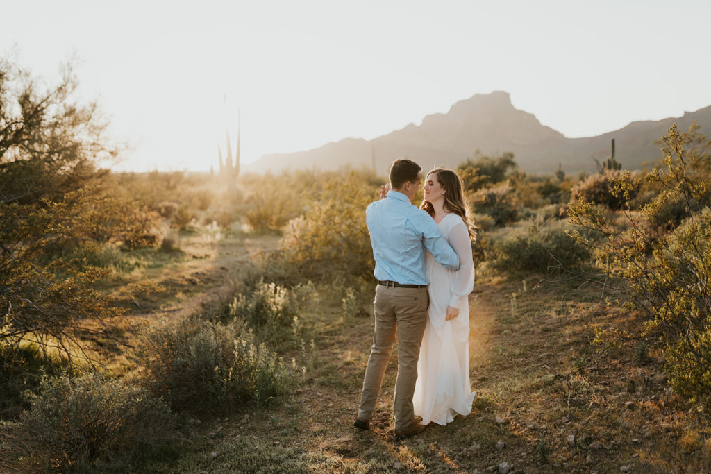 Happy couple take engagement photos in Arizona