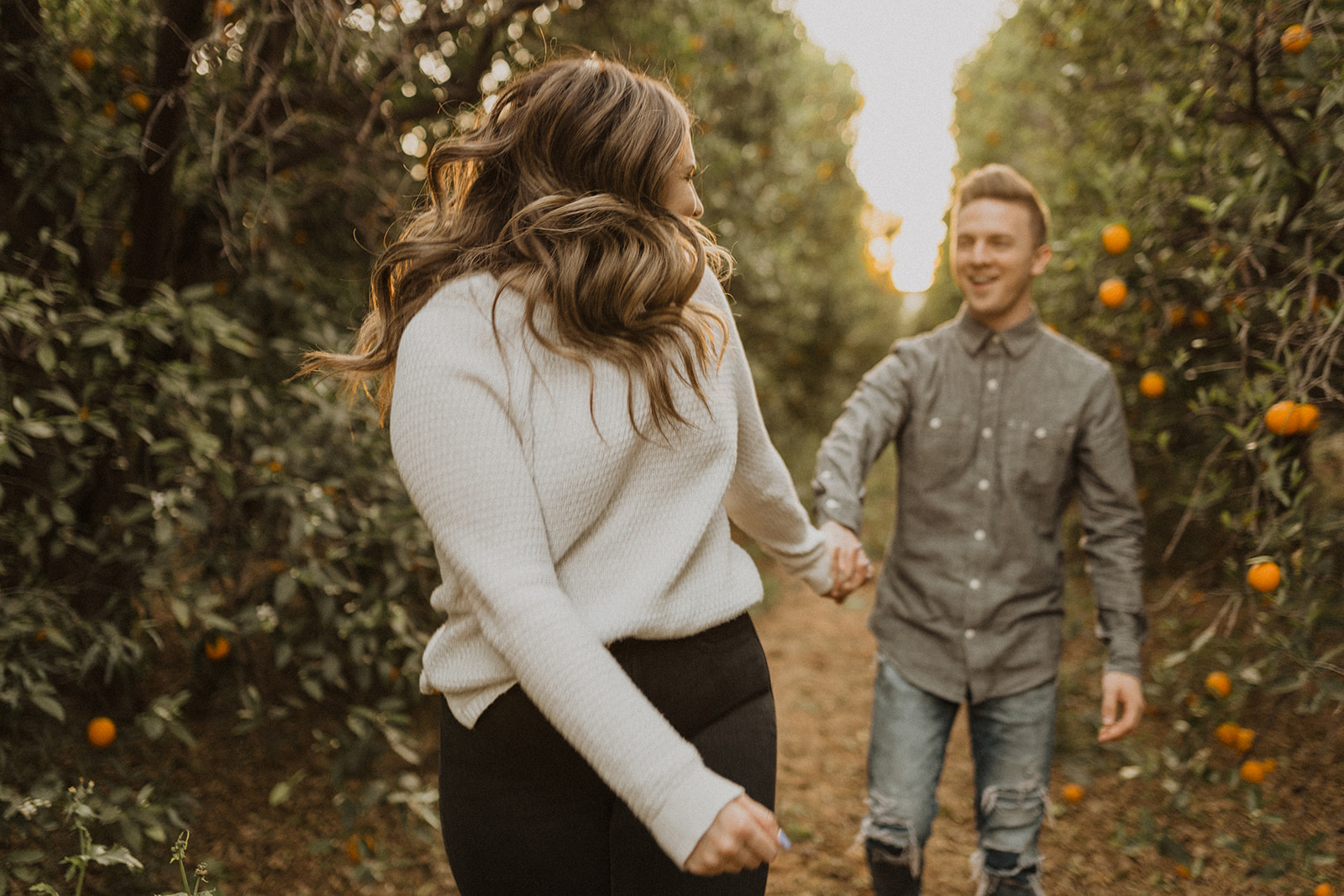Engagement Picture in an Orange Grove