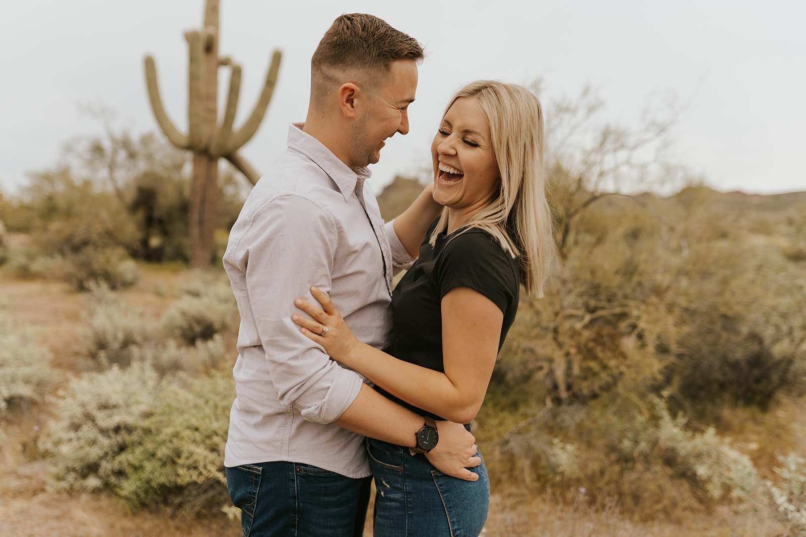 Laughing Couple in Desert Engagement Photo