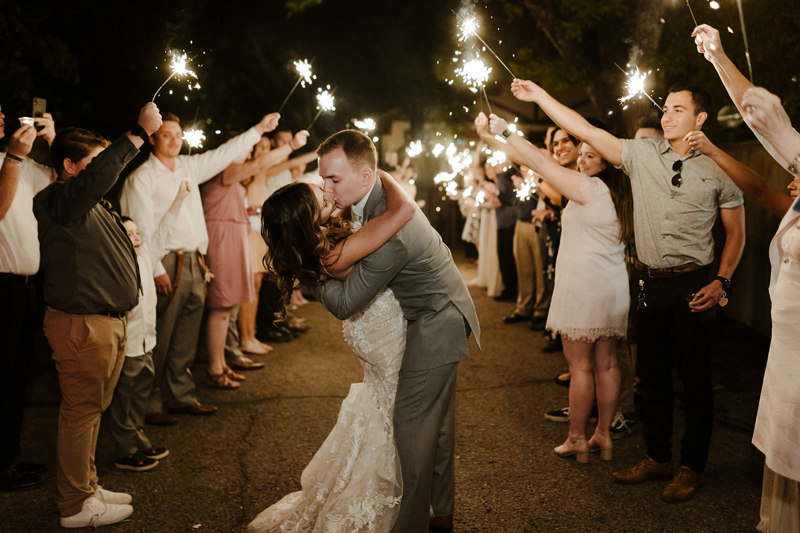 wedding couple kissing under sparklers at the wright house